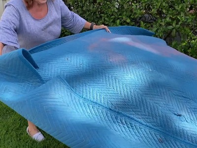 She lays a packing blanket in her backyard for a breathtaking idea!