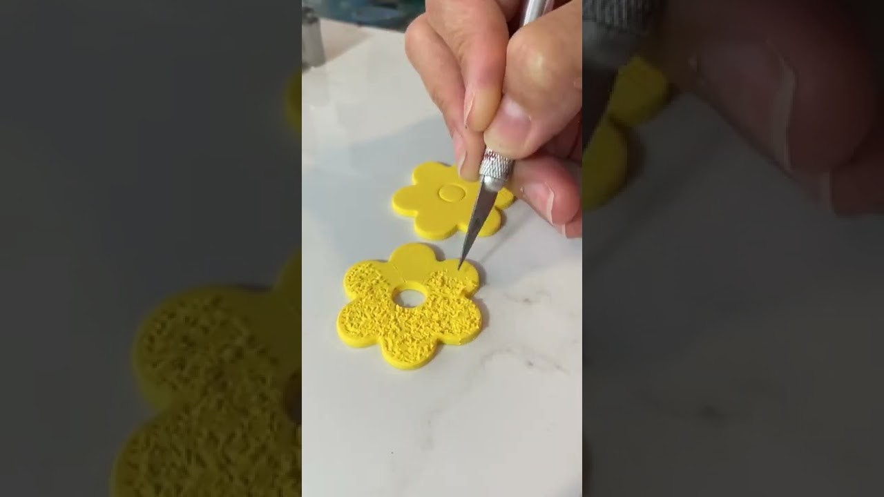Making polymer clay flower earrings.