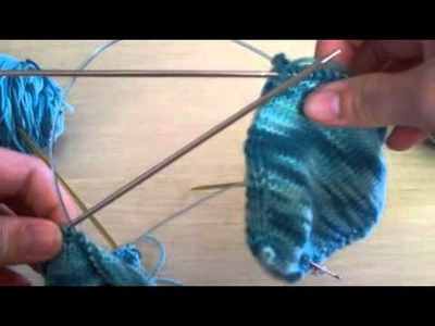 Toe up two at a time on two circular needle socks.