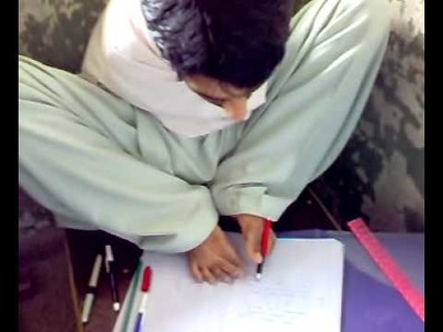 A student who has no arms and he is writing with his feet 