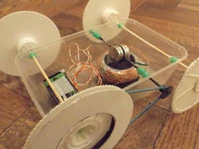 Home made electric motor drives home made toy car