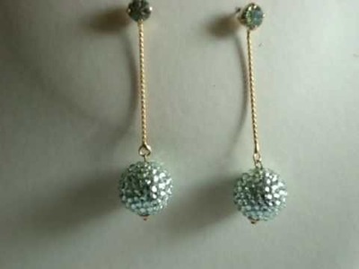 Swarovski crystal dangling ball earrings green chrysolite