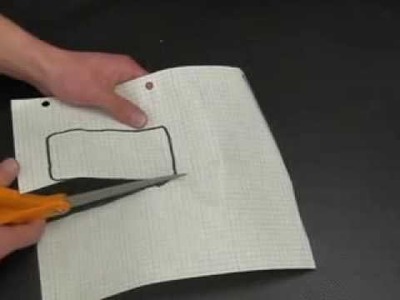 Cutting a piece of paper with scissors