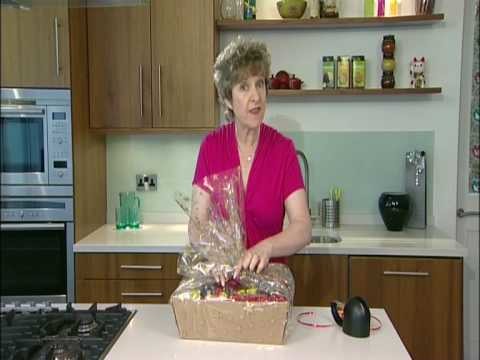 Wrapping a hamper using cellophane wrap