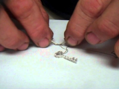 How to untangle a chain, untangle jewelry, knot out of a neclace, knot out of a chain.