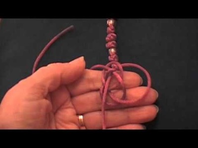 Chinese Button Knot tied around the fingers with Two Cords