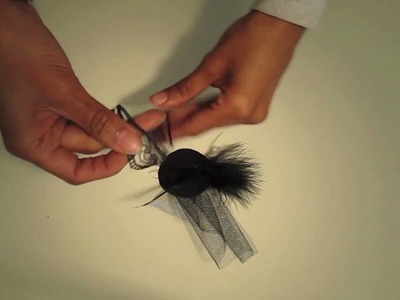 How to make a brooch using a Feather duster, button and clip of fabric