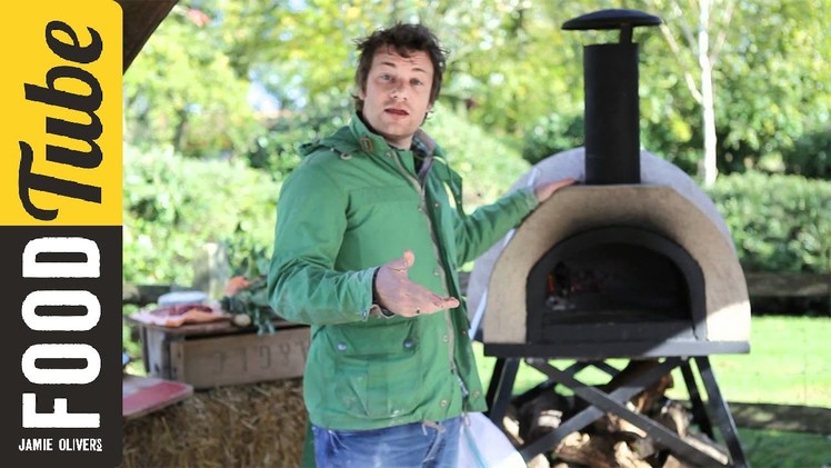 Jamie Oliver shows you how to cook pizza in a wood fired oven
