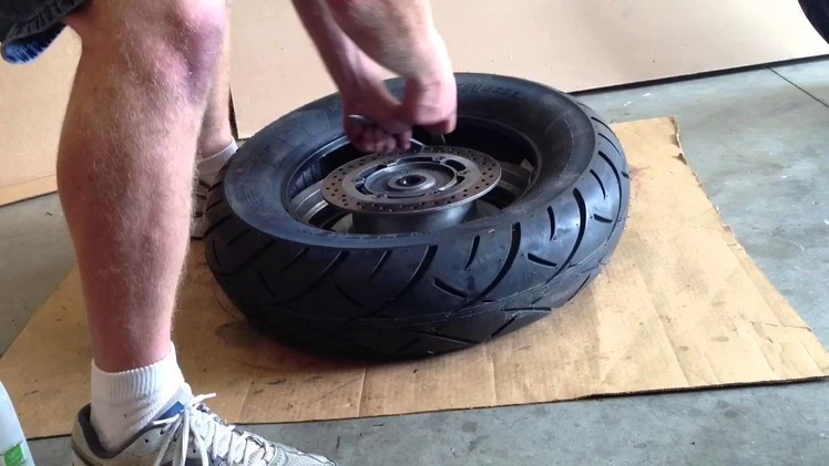 Removing and replacing a motorcycle tire from the rim.