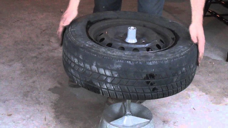 Balancing a tire with a bubble balancer