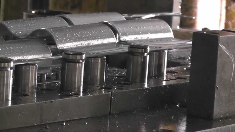 Progressive tool; pole clamp stamping