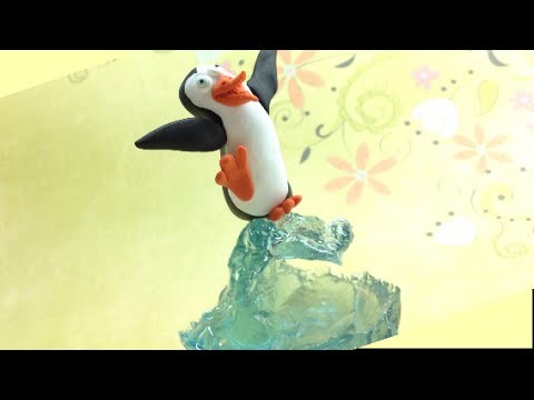 Polymer clay (Fimo) and resin- Surfer penguin