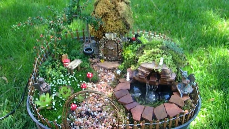 Fairy garden with pond and waterfall miniature
