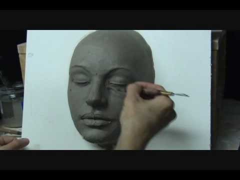 Sculpting a  female face in clay. Demo how to sculpt a face.