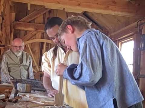 This is the Place Heritage Park's  Master Woodworker Aaron Mc Donald teaches young apprentice