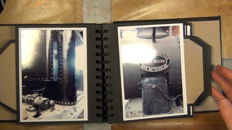 A MINI ALBUM WITH A HIDDEN COIL BINDING AND SLIDER TAGS
