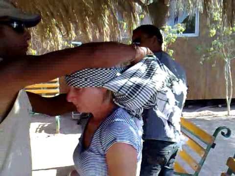Putting on a bedouin head scarf