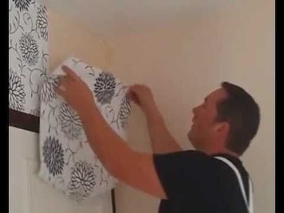 Wallpapering a feature wall. 
