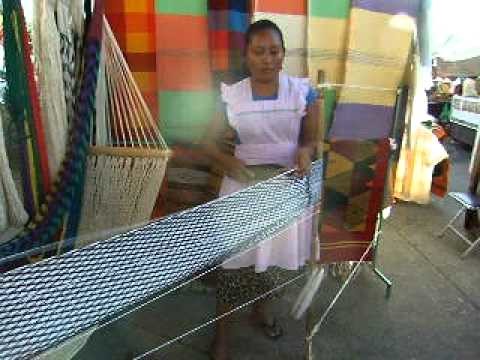 We stop a a market down town and she is making a hammock. she could make this with her eyes closed