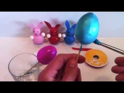 Painting and decorating spun cotton eggs for Easter