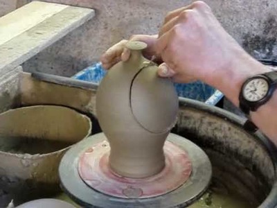 Making a clay Pottery Ceramic Salt Jar. Salt Pig on a potters wheel throwing demo
