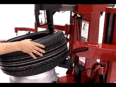 Tire Changers - COATS 9024E Rim Clamp Tire Changer Servicing a Bridgestone Runflat