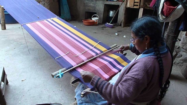Weaving a scarf in the ancient technique of discontinuous warp.