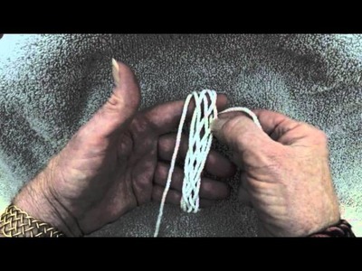 Tying a bracelet.