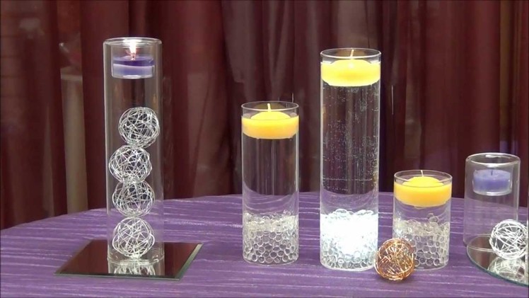 Centerpiece idea - tea light cylinders - from Surroundings.com