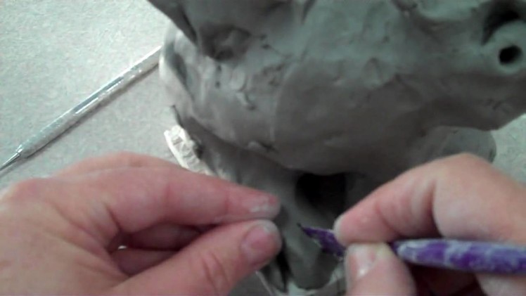 Making gargoyle adding eyes, feathers, toes,scales, pattern . .wmv