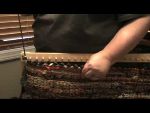 How to remove a finished twined rug from a peg loom.