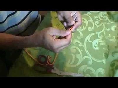 Husband shows how to make yarn hoop earing