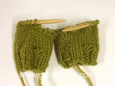 DROPS Knitting Tutorial: How to slip 2 legs for pants on to the same circular needle.