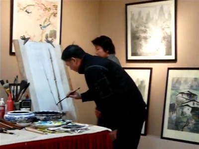 Chinese artist painting on rice paper in Guilin