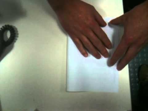 "How to" with Rich and Russ. Folding a piece of A4 paper to A5.