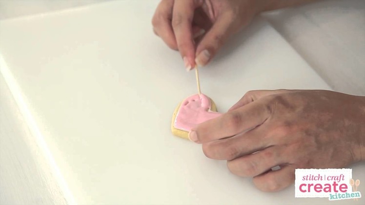 How to flood a cookie with royal icing and add polka dots | Cake Craft Made Easy