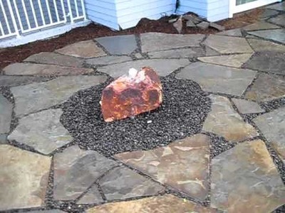 Raised Patio with Rock Bubbler by Creative Cascades