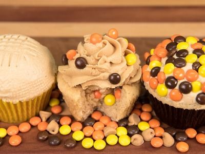Candy Stuffed Peanut Butter Cupcakes with Peanut Butter Frosting from Cookies Cupcakes and Cardio