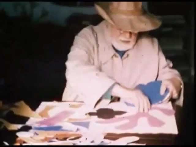 Footage of Henri Matisse making a paper cut out