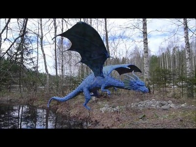 Flying paper mache dragon sculpture