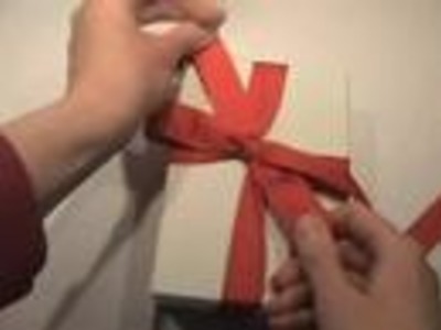 Tying a bow on a gift box