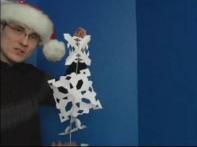How to Make Paper Snowflakes for Christmas Decorations : How to Hang Paper Snowflakes on a Wall
