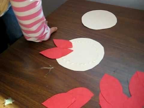 Christmas. Arts and Crafts activity: Red color paper poinsettia flower idea for kids.