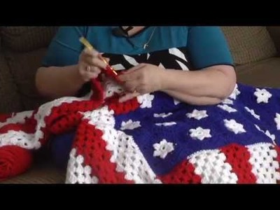 Woman gives 150 American Flag afghans away