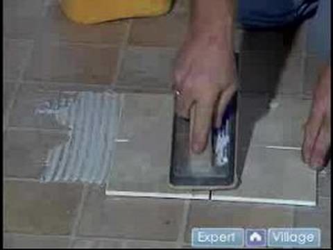 How to Install Flooring in Your Basement : Applying Grout to Install New Flooring in Your Basement