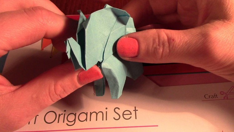ASMR showing origami craft *soft whisper* plastic crinkling, paper sounds*