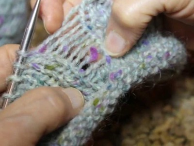 Fixing a mistake by dropping a stitch in Stockinet and Garter.
