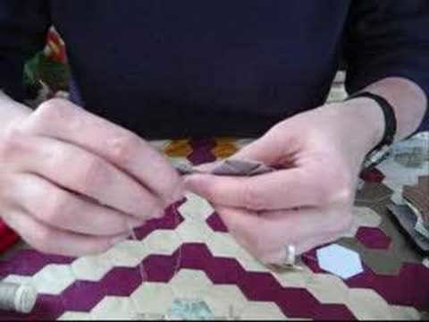 2) demonstration hand sewing patchwork hexagons together