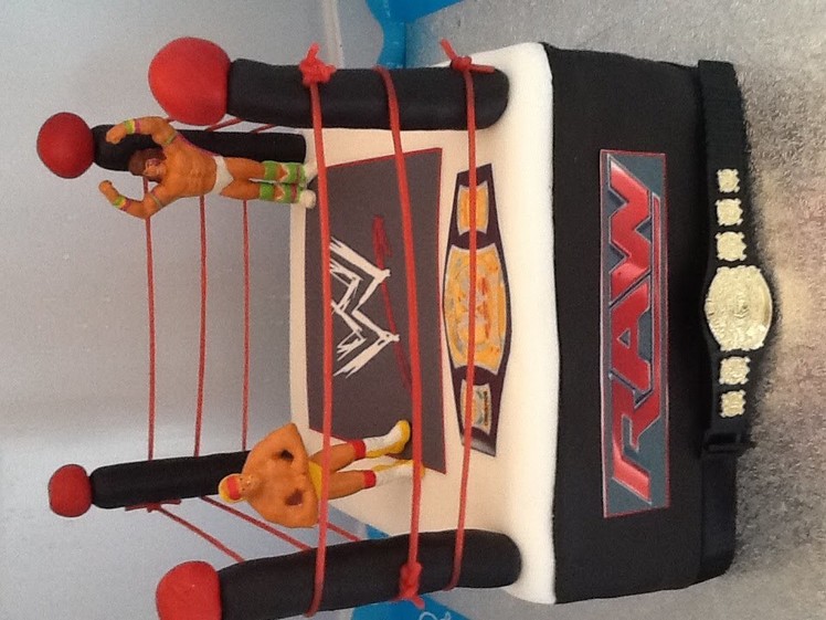 Wwe cake.   Wrestling. fondant .how to make.-roll fondant for posts then push bamboo stick through