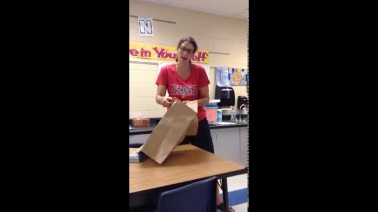 Covering a textbook with a paper bag
